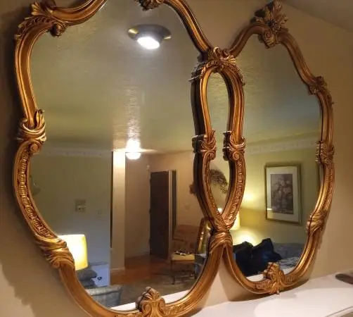 Ornate Gold Framed Wall Mirror with Scalloped Double Frame Design