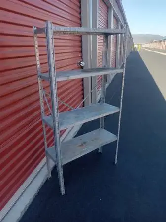 Metal garage storage rack with 3 shelves $25,excellent condition