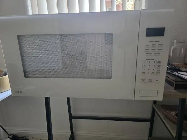 Profile 2.2 cu. ft. 1100-Watt Countertop Microwave in White with Built -In Senso