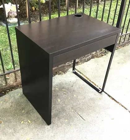 Dark brown wood desk with drawer