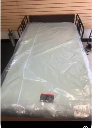 Medical Hospital bed with rails, mattress, head and footboard, table