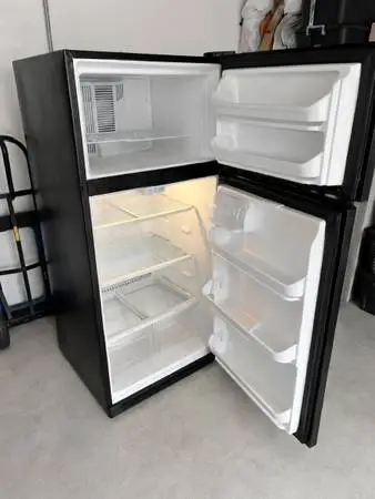 One year old black refrigerator