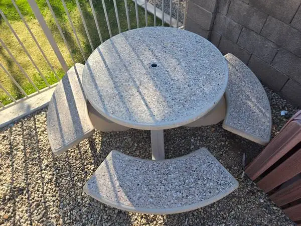 round concrete table and 4 benches