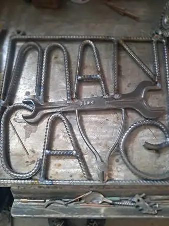 Metal Man Cave Sign