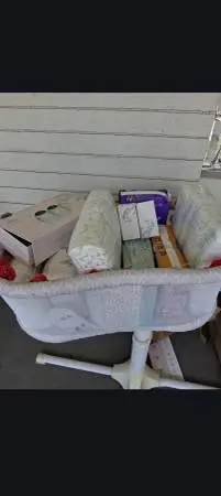 Bassinet and baby stuff along with diapers
