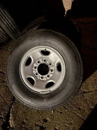 (4) Bridgestone LT 245/75/16 Load Range E Tires on Chevy Van Wheels