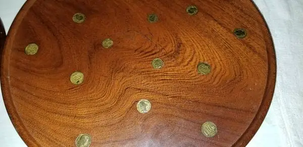 Matching wood platters inlaid with Argentine coins