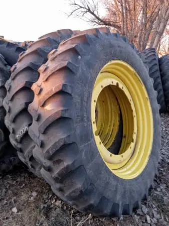 John Deere 12-bolt driver rims with various size radial tires