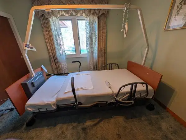 Med-Mizer Auto-Pivot Hospital Bed with Trapeze Bar & Air Mattress Pad
