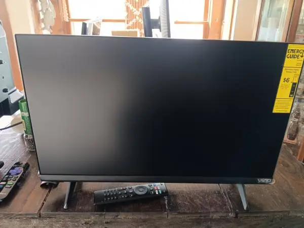 2 good flat screen tvs Vizio and ONN ROKU TV