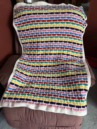 **MULTI-COLORED KNITTED BABY AFGHAN**