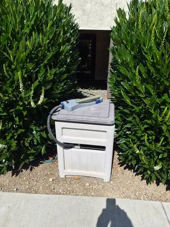 Garden hose storage box and hose