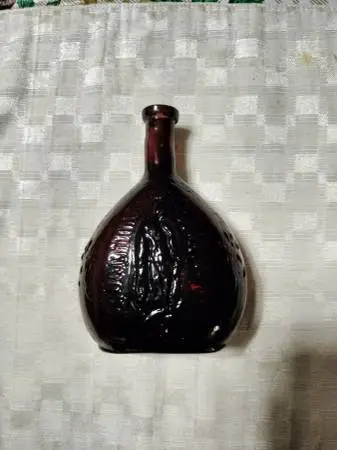 Antique Amethyst mold Brown glass Lady of Guadalupe holy water bottle