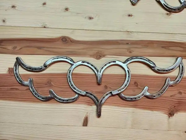 Horseshoe heart with wings