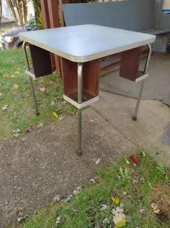 Unique pub table with drink holders below tabletop