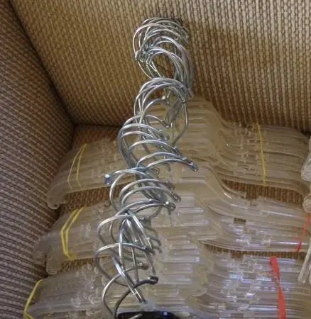Large lot of clear and solid plastic kids hangars