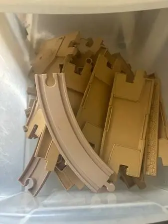 Four sets of train tracks with towers, clocks, bridges and more
