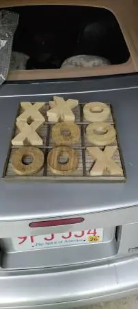 Rustic wooden tic tac toe game