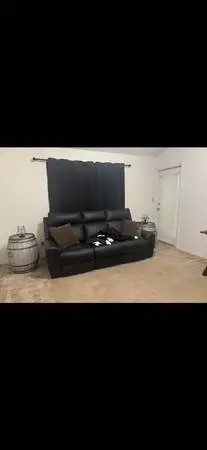 Black leather reclining couch