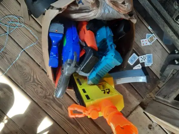 Box of nerf guns with dart and balls