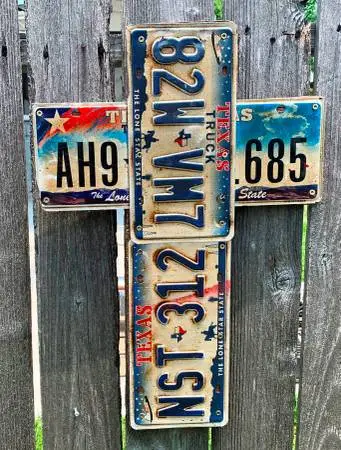 Home made wood cross with Texas license plates covered
