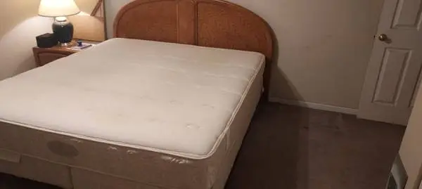 king size bed with frame and headboard and nightstand