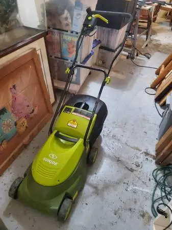 Small Sun Joe electric lawnmower