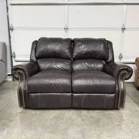 Beautiful Leather Reclining Loveseat.