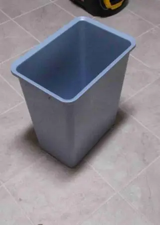 Blue plastic trash can