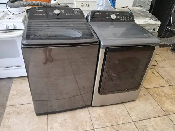 Samsung jumbo black top load smart washer and gas dryer