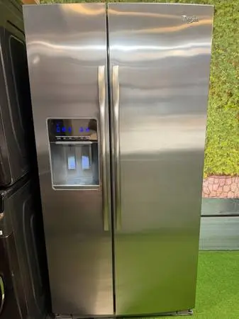 Stainless steel side-by-side refrigerator made by whirlpool counter depth