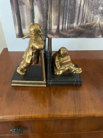 Brass book ends.