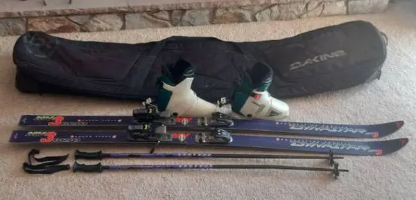 Dynastar skies, Smith poles, Heierling boots & Dakine Bag
