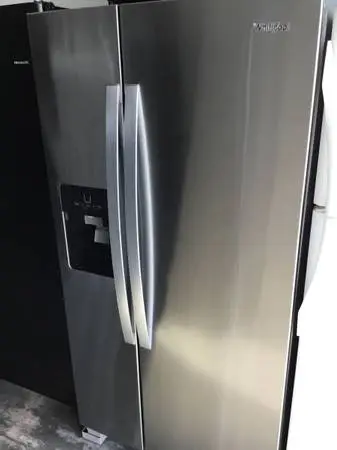 Stainless steel Whirlpool refrigerator side by side