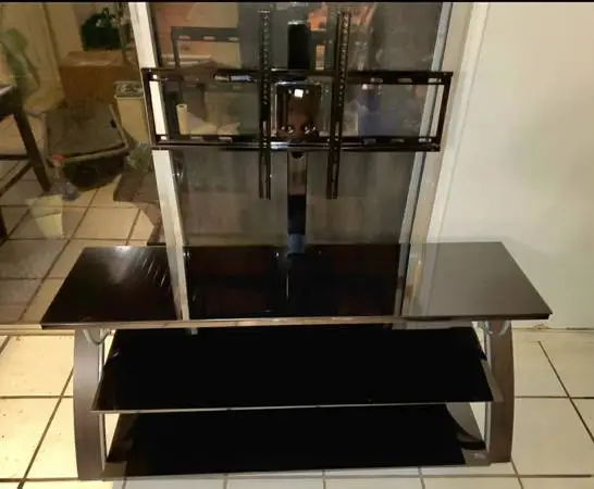 Metal TV Stand with Glass Shelves fits many size Televisions
