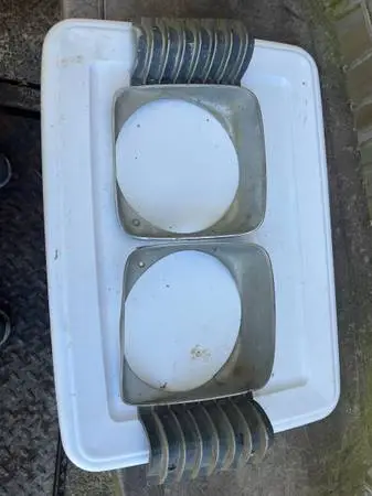68 nova headlight bezels original lh.rh