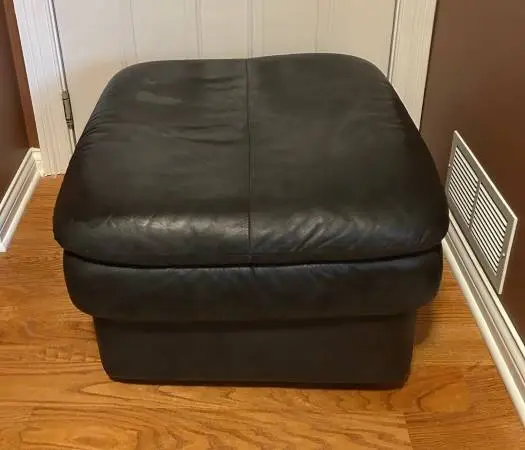 Faux leather ottoman on wheels