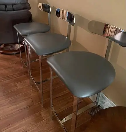 THREE INTERLUDE CHROME and LEATHER COUNTER STOOLS