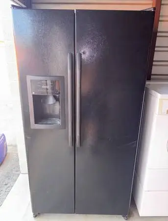 Black GE Refrigerator And Freezer