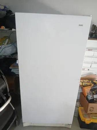 Upright freezer (Kenmore) with food
