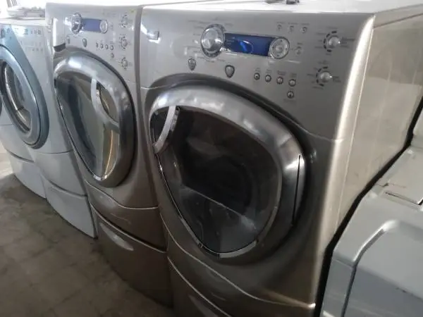 🌲GE Profile tan front load washer and dryer set on pedestals