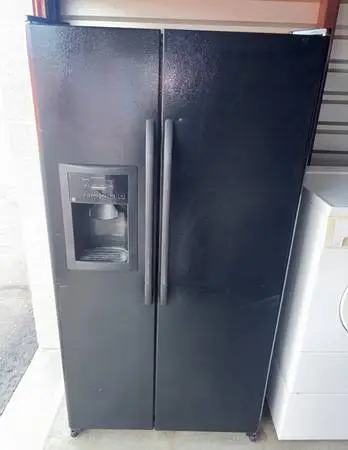 Black GE Refrigerator And Freezer