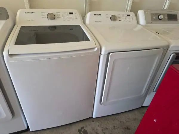 Self clean top load washer and gas dryer