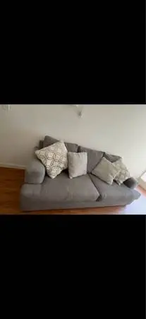 Living Spaces Grey Sofa Bed with pillows