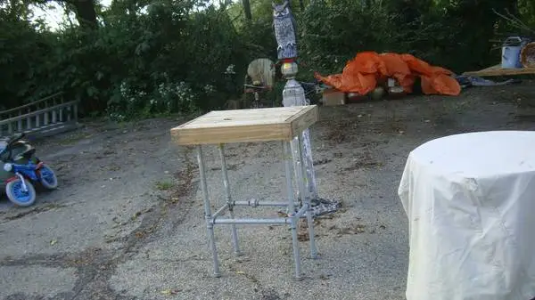out door patio table pipe legs top is 2 by 4 size is 3ft tall