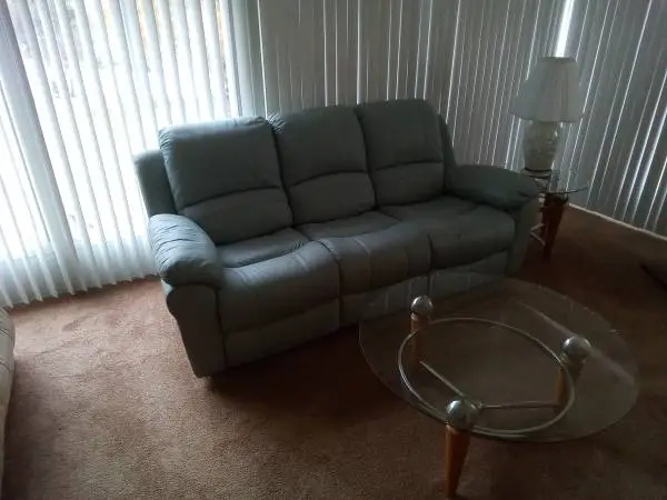 Reclining leather sofa, end tables, coffee table, lamps