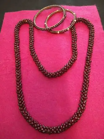 ** SOLD**.INTAGE 1980S WOVEN GARNET NECKLACE AND TWO BANGLE BRACELETS