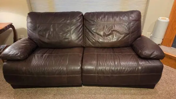Leather power reclining sofa