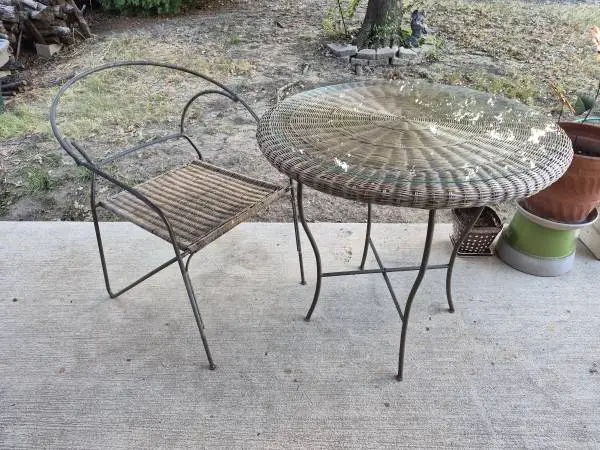wrought iron round table, wicker, glass tabletop, matching chair, used