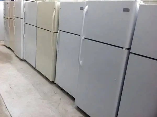 Top freezer style refrigerator